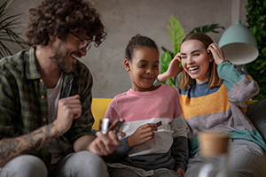 foster parents laughing with child